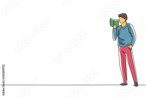 Continuous one line drawing guy standing and reads book that holds in one hand. Young man love to read. Male students with open books in hands. Single line draw design vector graphic illustration