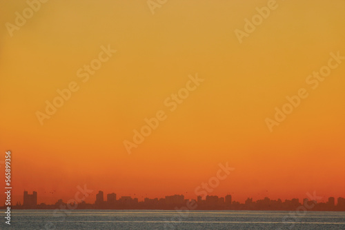 The sun sets over the Mozambique capital city of Maputo as seen from Inhaca Island.