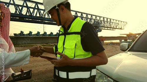 Middle East businessmen are conducting on-site construction inspection with male engineers