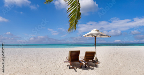 Fototapeta Naklejka Na Ścianę i Meble -  Beautiful panoramic nature. Tropical sunny beach as summer island landscape with chairs umbrella palm leaves calm sea shore, coast. Tranquil travel panoramic destination banner for vacation or holiday