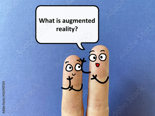 Two fingers are decorated as two person. One of them is asking another what is augmented reality. photo