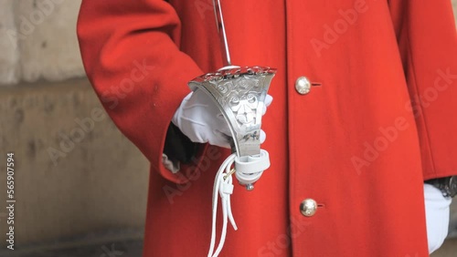 A view of a British army’s household cavalry member holding a sword. photo