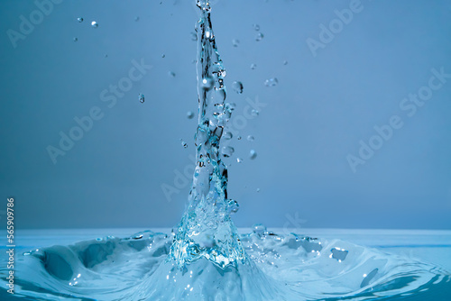 Water fountain and splashing drops above water surface