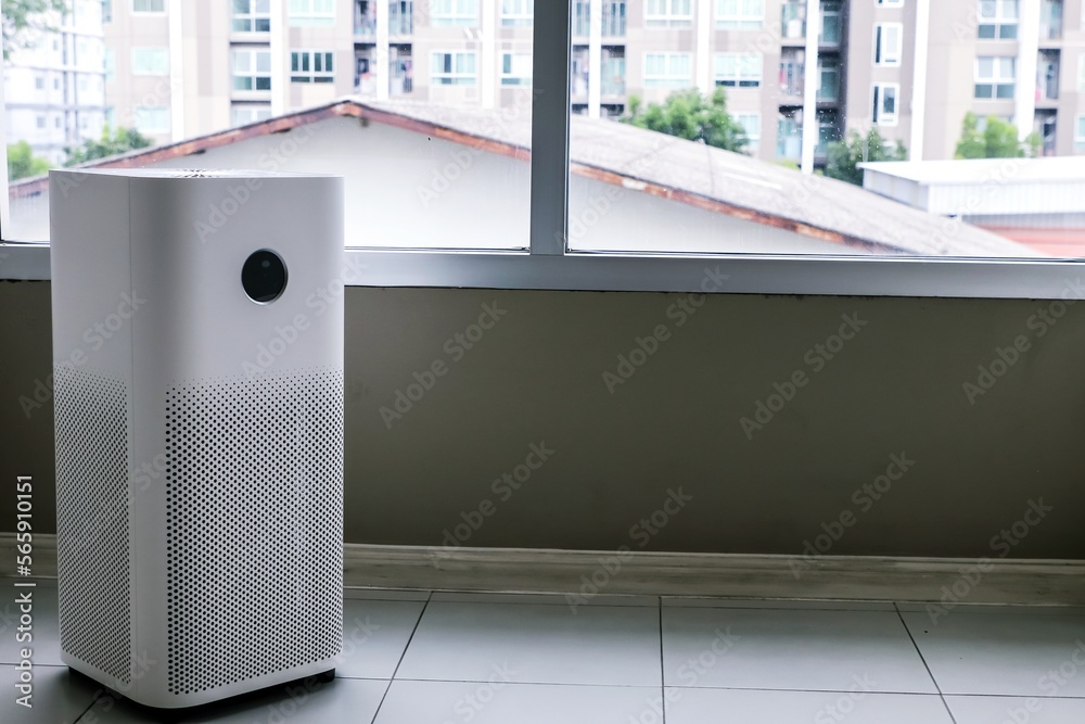 Image showcasing Air purifier inside room beside glass wall for air cleaner remove fine ...
