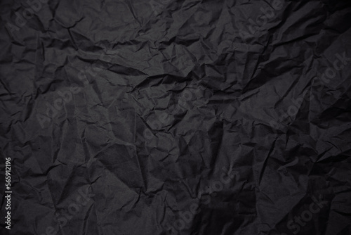 Black crumpled craft paper background. Black history month concept. Copy space