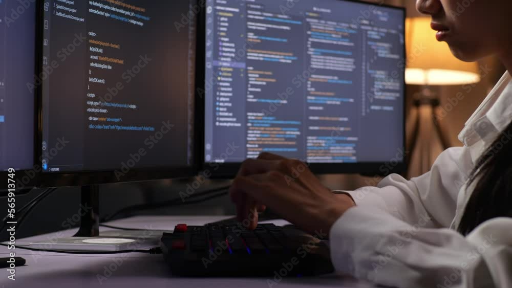 Close Up Of Asian Female Programmer Creating Innovative Software Engineer Developing App, Program, Video Game On Desktop Computer At Home. Terminal With Coding Language