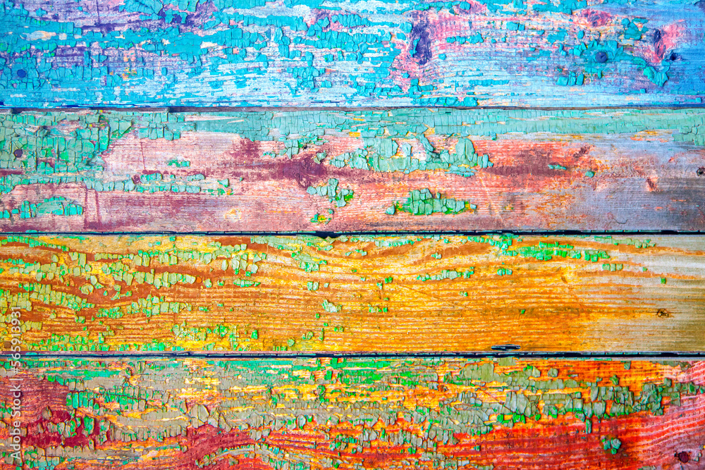 fragment of background from boards painted in rainbow colors