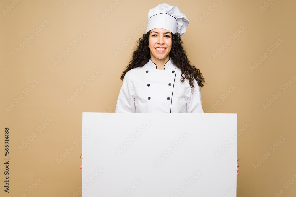 Excited latin chef showing the menu Excited latin chef showing the menu