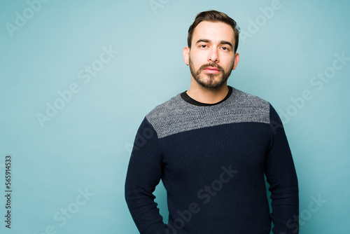 Serious somber caucasian man looking at the camera