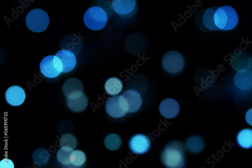 Defocused blue lights background over Dark