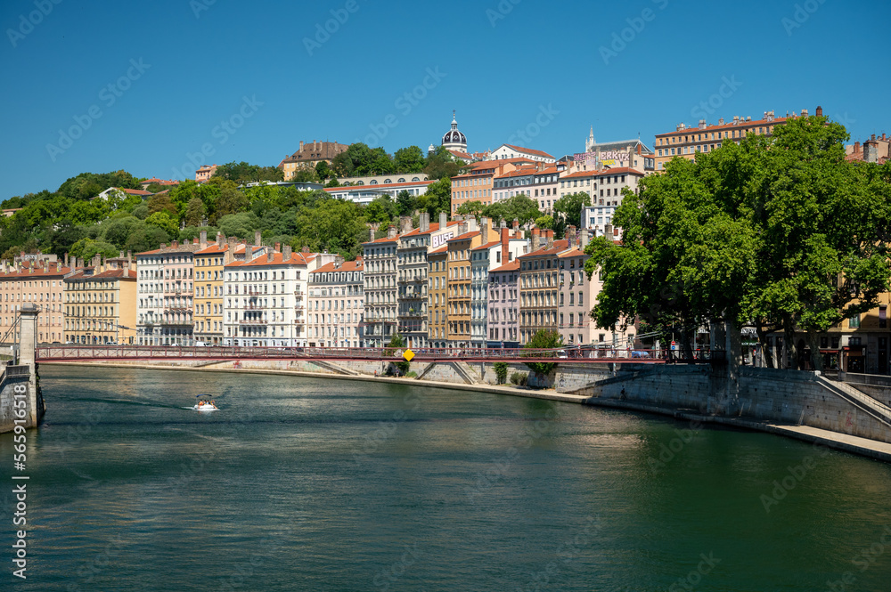 Tourist destination, views of Rhone river, streets, houses, cafes in old central part of Lyon in summer, France