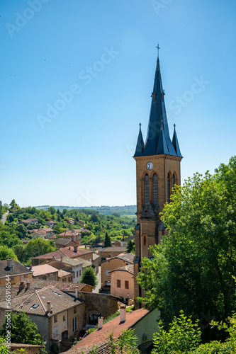 Wine making region Beaujolais Pierre dorees wioth yellow houses and hilly vineyards, sunny day in France