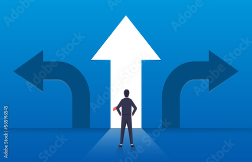 Choice and decision, businessman standing with arrows in three different directions, pathway selection dilemma photo