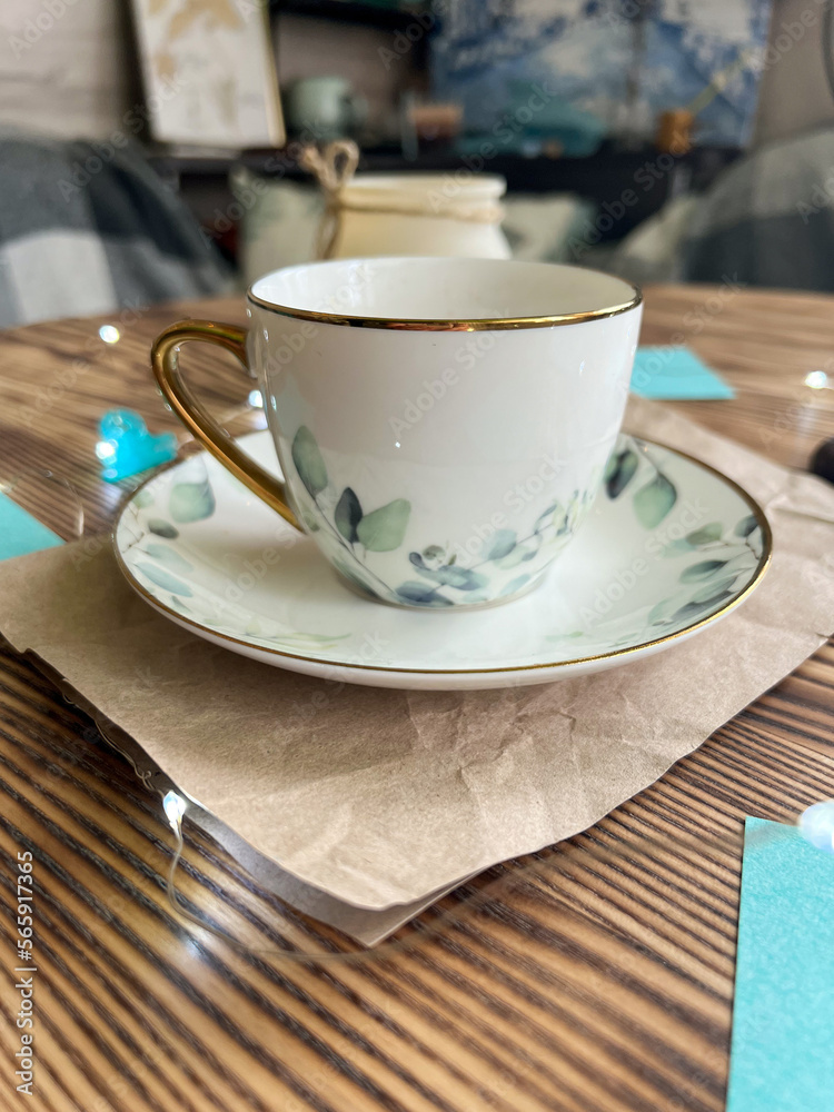 Fototapeta premium Cup of coffee on wooden table 
