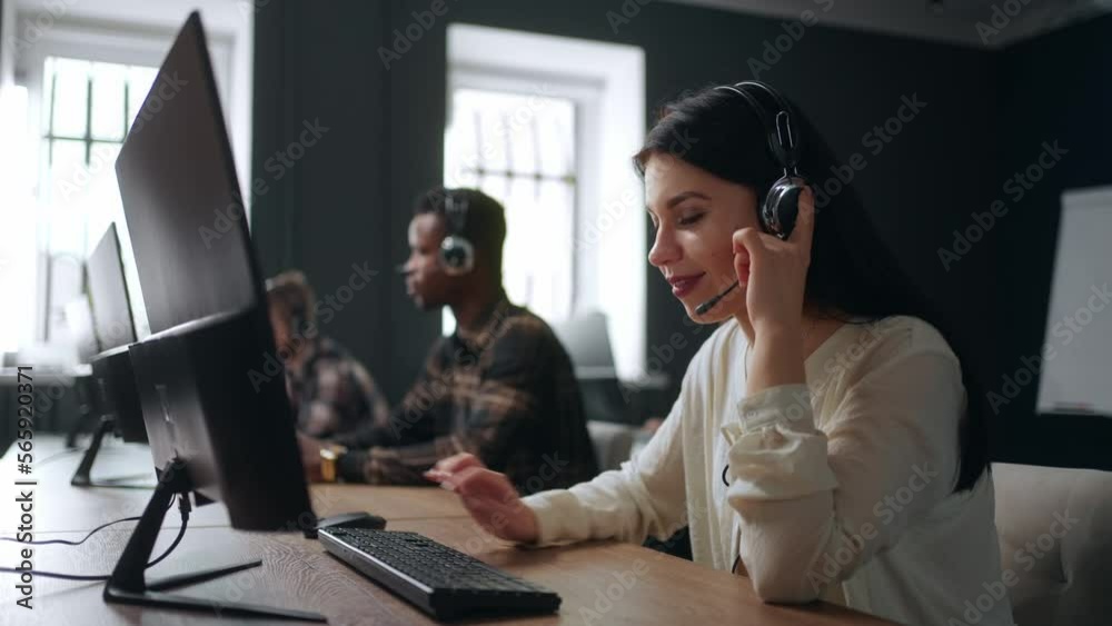 multiethnic people work in call center of big company, woman with headset answer on phone calls