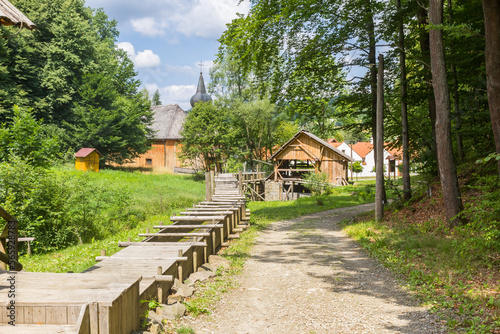 Wooden water mill in the forest of Nowy Sacz, Poland photo