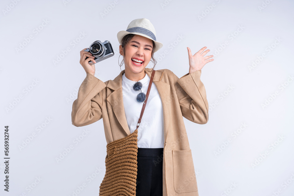 ready to travel ,young teen asian smiling cheerful female woman casual cloth hand hold camera standing with luggage case bag prepare to new abroad journey travel studio shot on white background ready to travel ,young teen asian smiling cheerful female woman casual cloth hand hold camera standing with luggage case bag prepare to new abroad journey travel studio shot on white background
