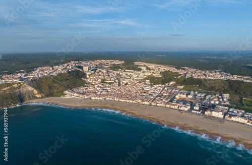 Fototapeta Naklejka Na Ścianę i Meble -  Nazare Town in Portugal. Beach and Cityscape. Drone Point of view.
