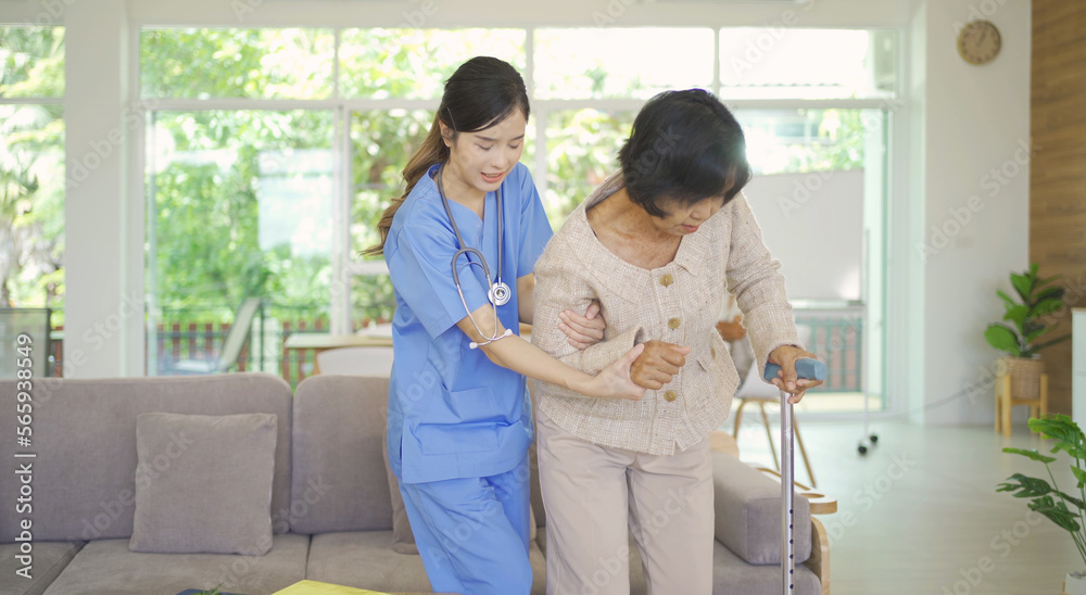 Fototapeta premium Woman nurse takes care of sick old senior elderly patient sitting on wheelchair in hospital in medical and healthcare treatment. Asian Thai people lifestyle. Family encourage.