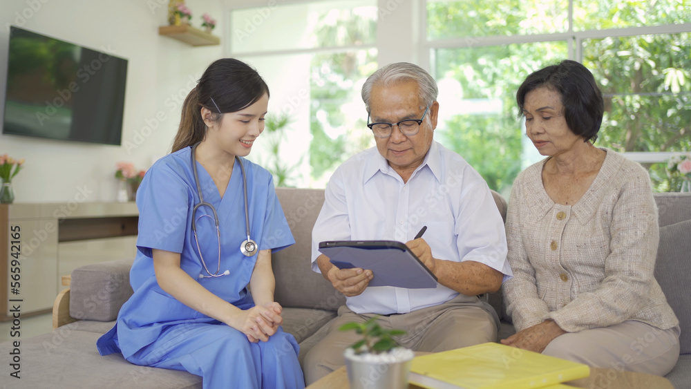 Fototapeta premium An Asian nurse talking to a group of old elderly patient or pensioner people smiling, relaxing, having fun together in nursing home. Senior lifestyle activity recreation. Retirement. Health care