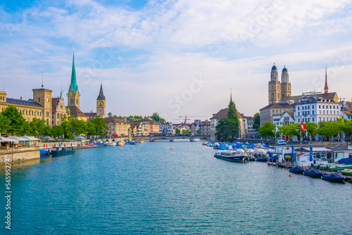 Scenic panoramic view of historic Zürich city center with famous Fraumünster and Grossmünster Church and river Limmat at Lake Zurich on a beautiful sunny day with blue sky in summer, Switzerland