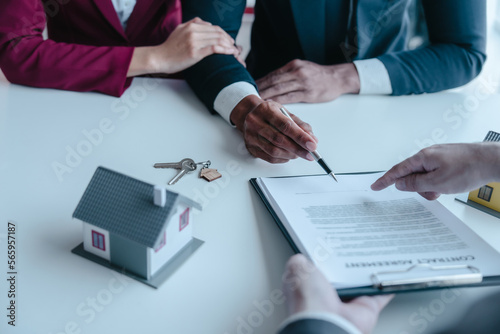 Businessperson real estate purchase agreement contract after sign official offer form is created by the homebuyer's agent and submitted to the seller