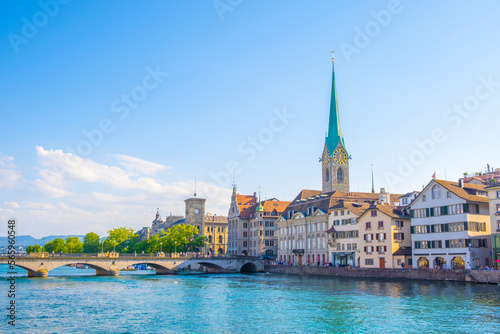 Scenic panoramic view of historic Zürich city center with famous Fraumünster and Grossmünster Church and river Limmat at Lake Zurich on a beautiful sunny day with blue sky in summer, Switzerland