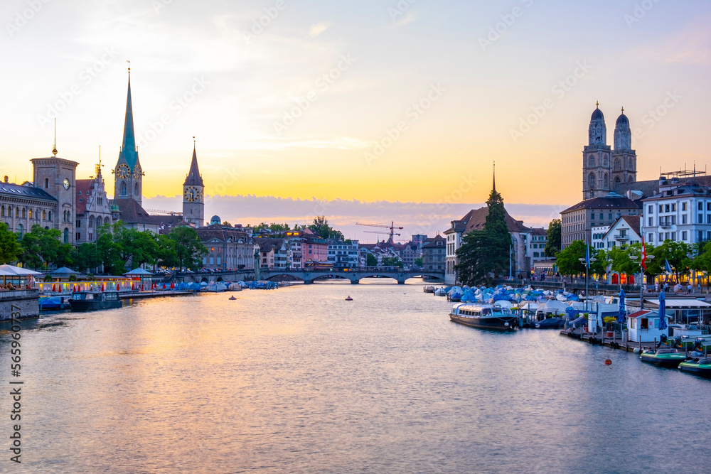 Scenic panoramic view of historic Zürich city center with famous Fraumünster and Grossmünster Church and river Limmat at Lake Zurich on a beautiful sunny day with blue sky in summer, Switzerland