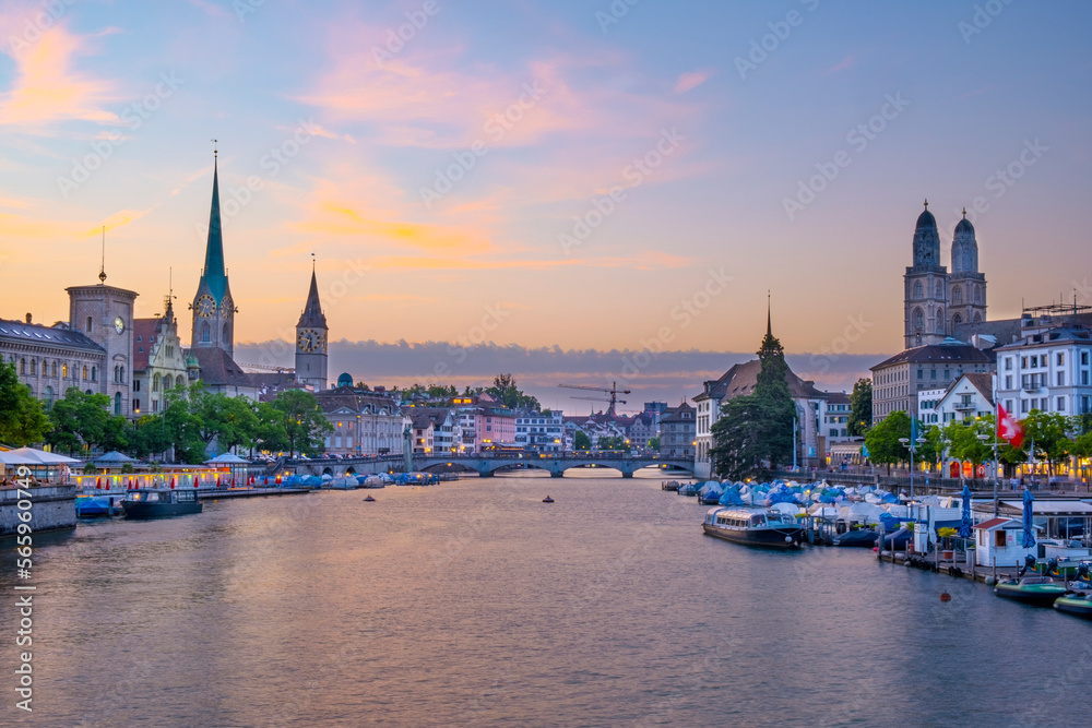 Scenic panoramic view of historic Zürich city center with famous Fraumünster and Grossmünster Church and river Limmat at Lake Zurich on a beautiful sunny day with blue sky in summer, Switzerland