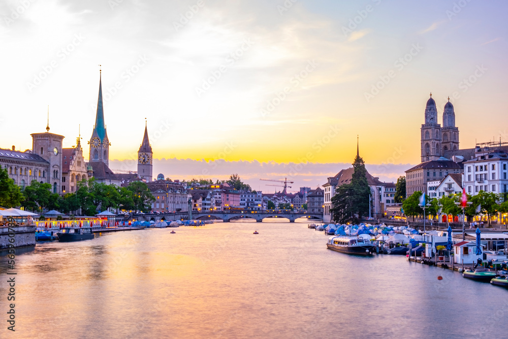 Scenic panoramic view of historic Zürich city center with famous Fraumünster and Grossmünster Church and river Limmat at Lake Zurich on a beautiful sunny day with blue sky in summer, Switzerland