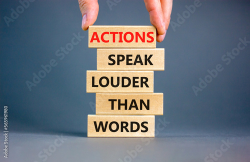 Actions speak louder words symbol. Concept words Actions speak louder than words on wooden blocks. Beautiful grey table grey background. Business new mindset for results concept. Copy space.