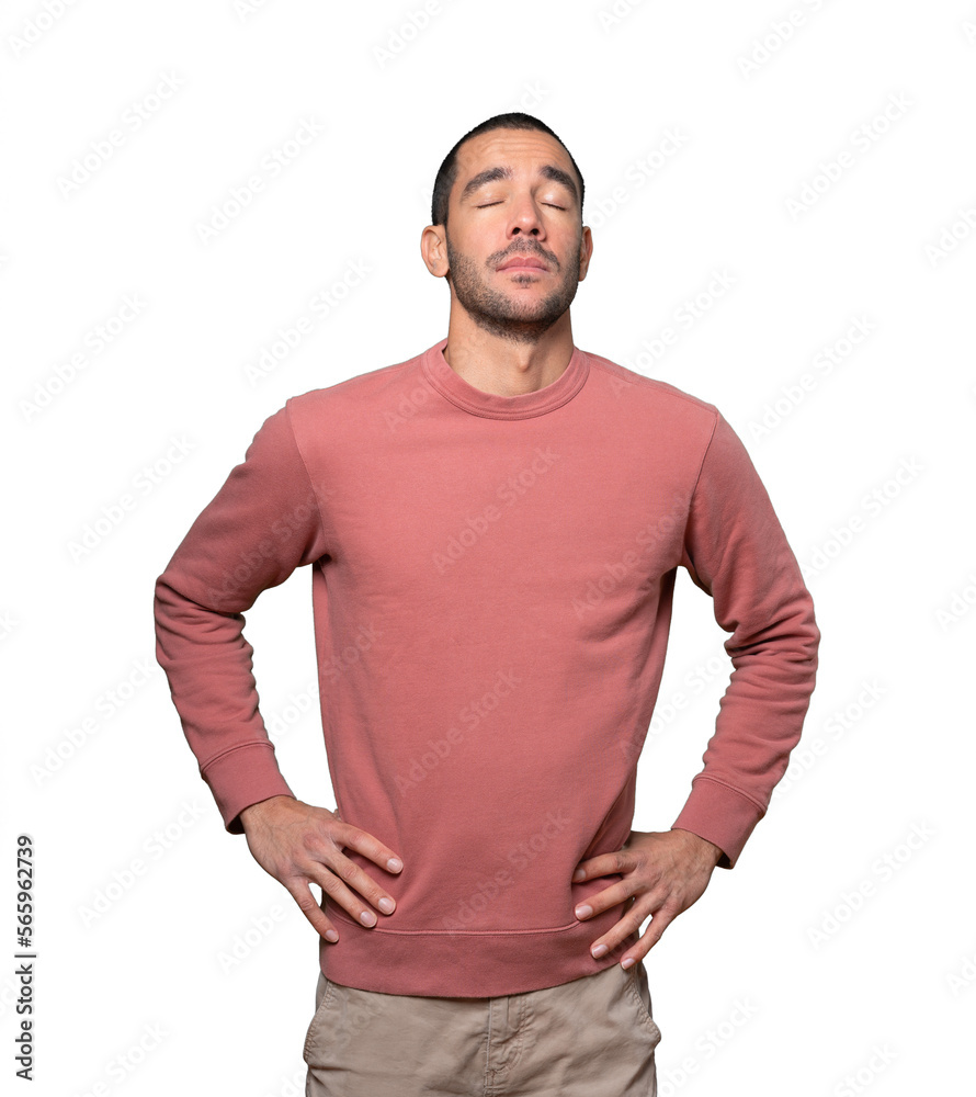 Fototapeta premium Tired young man posing against background