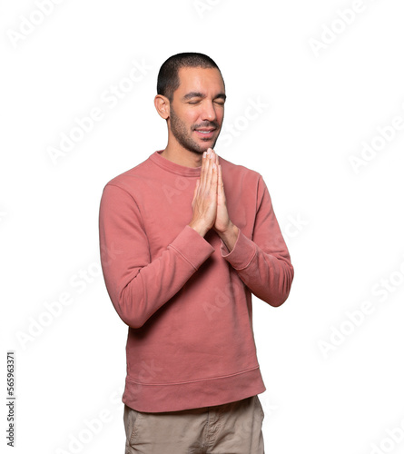 Concerned young man praying gesture