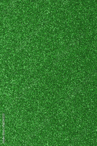 GREEN glitter material background with glowing effects and reflections