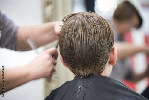 hairdresser cutting hair hairstyling job model profession grooming skill son workplace youngster youth wet workflow worker human indoors shop trimming 
