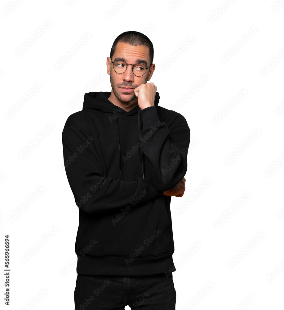 Serious young man with a gesture of disappointment Serious young man with a gesture of disappointment