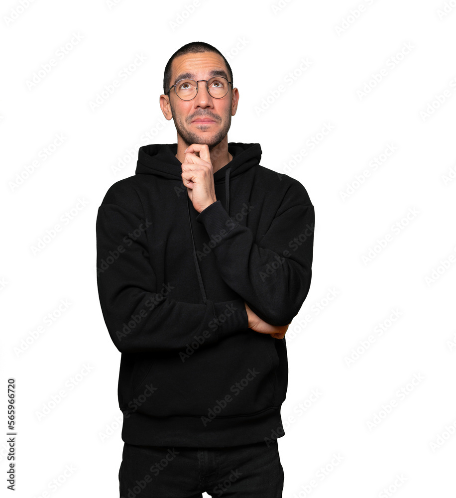 Surprised young man making a gesture of doubt Surprised young man making a gesture of doubt