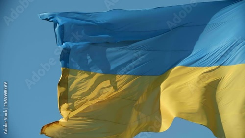 Ukrainian flag waving on the wind in the blue sky. High quality 4k footage. Blue and yellow colored flag close up photo