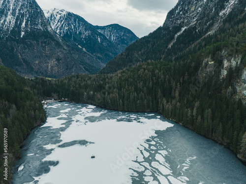 Frozen Lake Piburger See in the austrian Alps in Tyrol, Austria photo