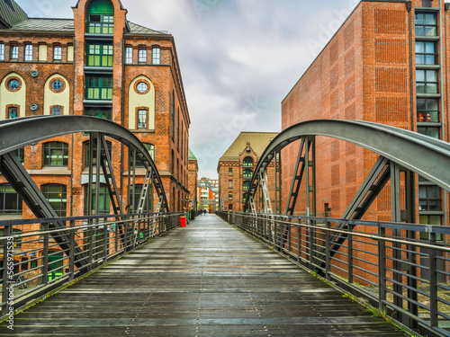 historic Red Brick Buildings and wooden bridge in Hamburg, Germany