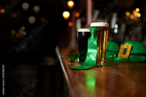 Two beers, hats and costume for St. Patrick's Day at the bar of an Irish pub