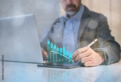 Businessman analysing budget of business market. Financial performance  revenue and costs concept.