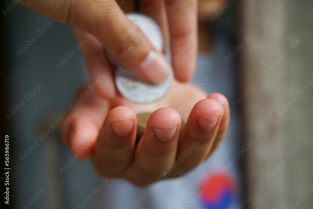 Stock photo of someone who is making a monetary donation Stock photo of someone who is making a monetary donation