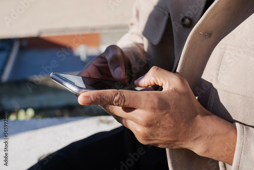 businessman writing on a smart phone