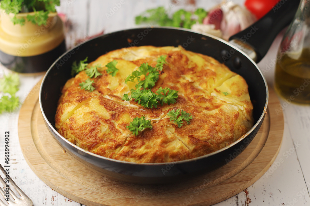 Traditional Spanish dish tortilla on the table Traditional Spanish dish tortilla on the table
