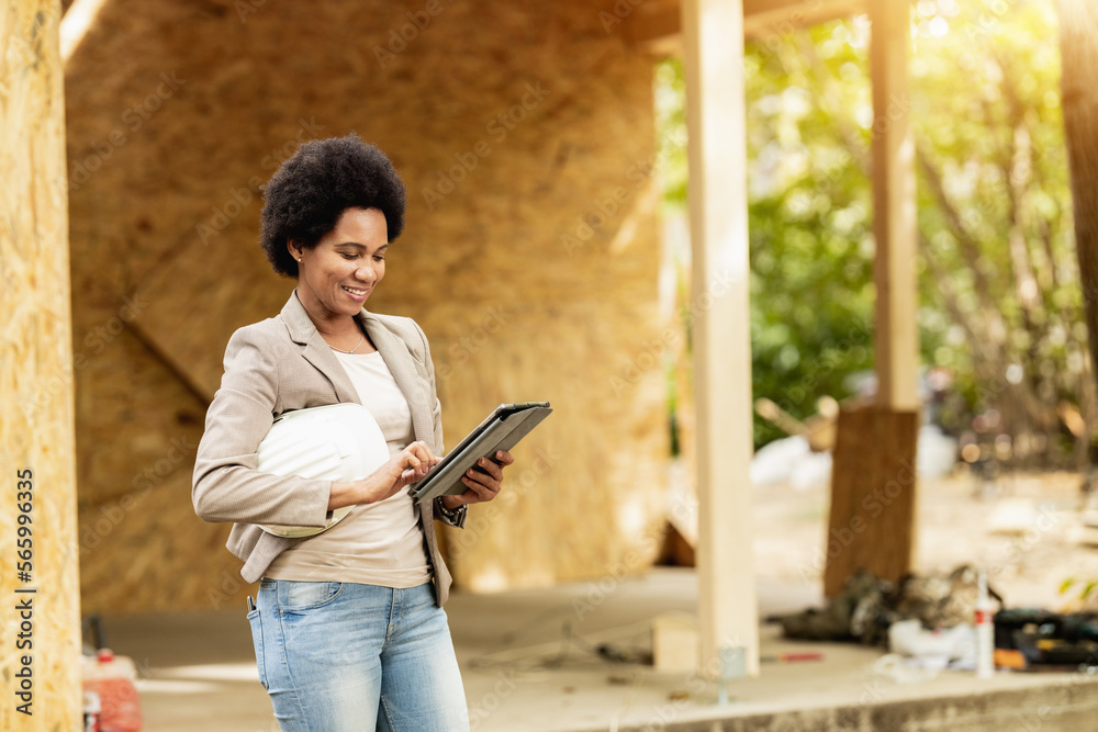 Black Woman Architect Using A Digital Tablet At Construction Site Black Woman Architect Using A Digital Tablet At Construction Site