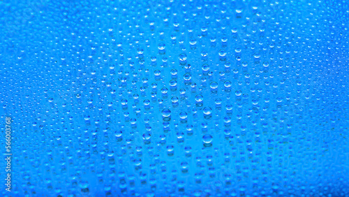 Water drops. Abstract gradient background. The texture of the drops. Blue gradient. Heavily textured image. Shallow depth of field. Selective focus