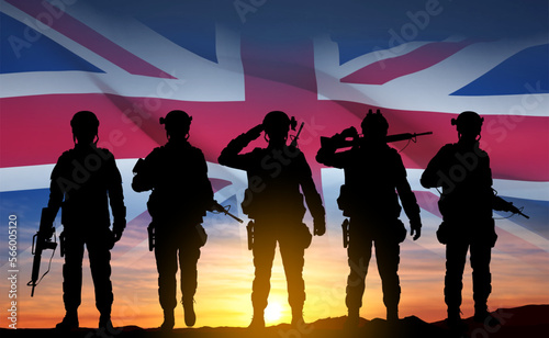 Silhouettes of a soldiers with United Kingdom flag on background of sky. Background for Remembrance Day. United Kingdom Armed Forces concept. EPS10 vector