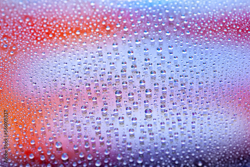 Water drops. Texture of the drops. Abstract gradient background. Color rainbow gradient. Heavily textured image. Shallow depth of field. Selective focus