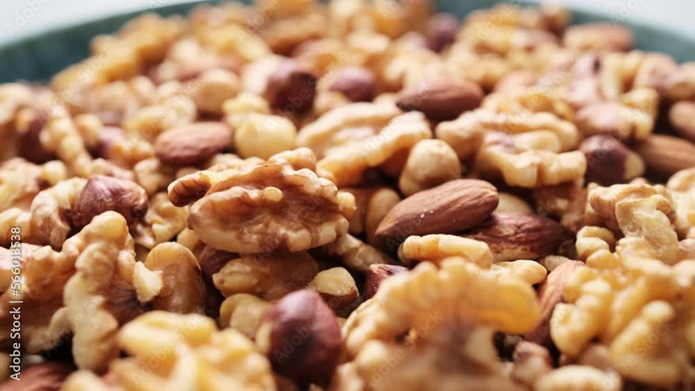 Nut mix of walnuts, hazelnuts and almonds bowl video 4k Nut mix of walnuts, hazelnuts and almonds bowl video 4k
